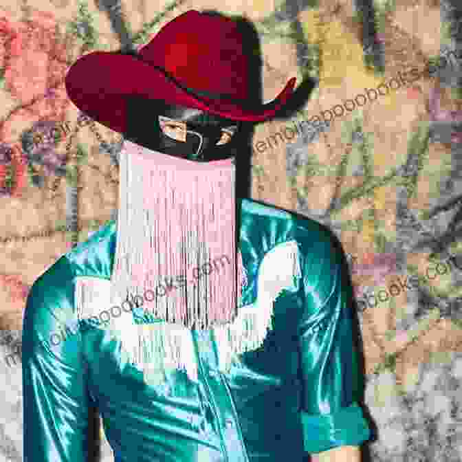 A Photograph Of Orville Peck, A Country Music Singer Wearing A Fringed Mask Rednecks Queers And Country Music