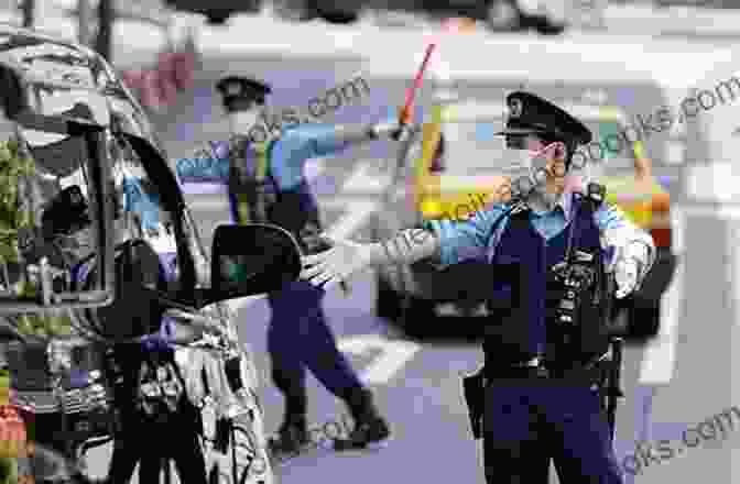 A Police Officer In Japan Standing In Front Of A Police Car How To Travel Safely In Japan