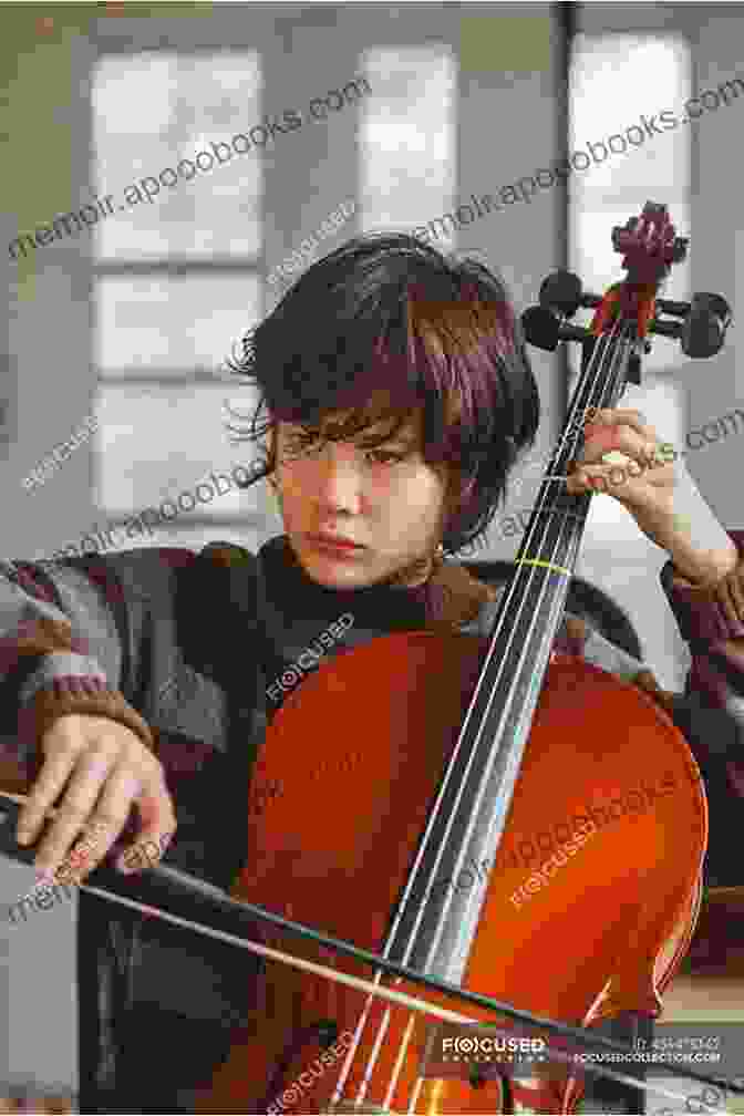 A Young Cellist Practicing With A Focused Expression First Lessons Cello Matthew L Beyranevand