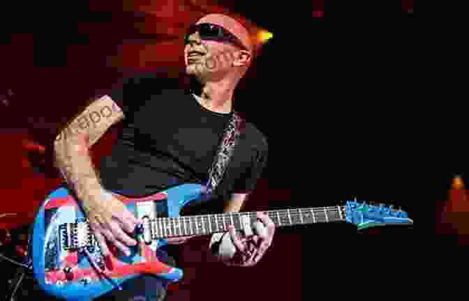 Joe Satriani Performing An Electrifying Guitar Solo Joe Satriani Guitar Secrets